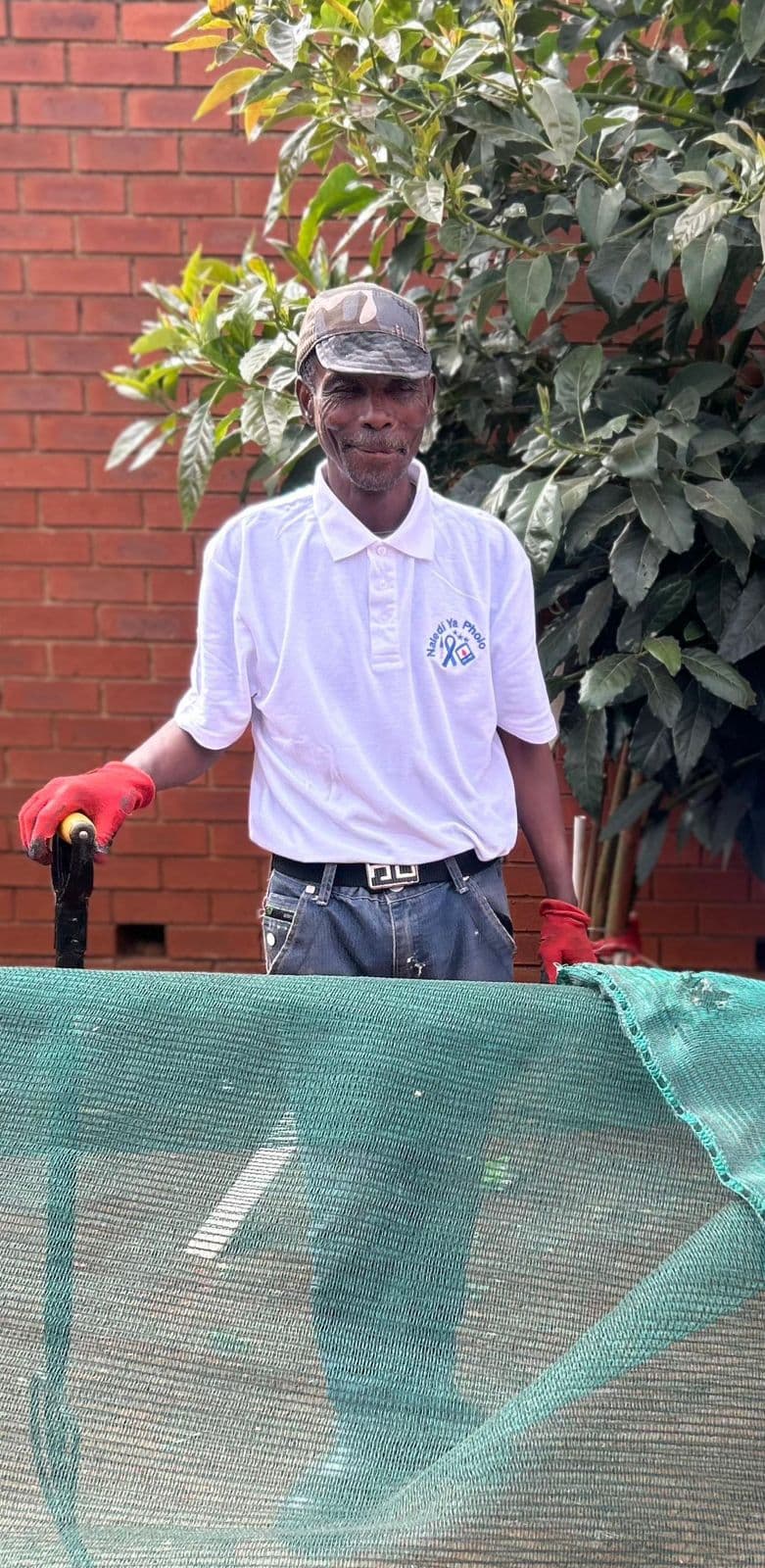Person standing near outdoor landscaping work