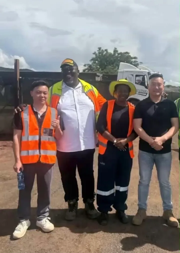Mining site delegation wearing protective equipment during a real operational visit